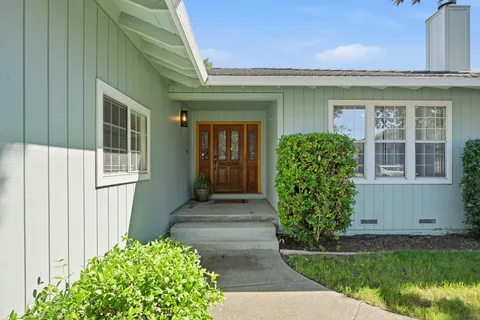 a front view of a house with garden