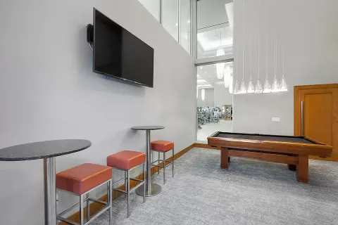 a building outdoor space with patio furniture and potted plants