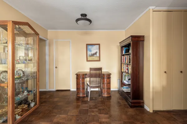 a work room with furniture and windows