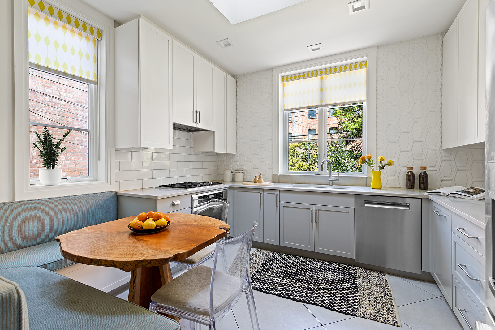 623 2nd Street Brooklyn, NY 11215 - Photo 8 of 26 a kitchen with a sink window and white cabinets