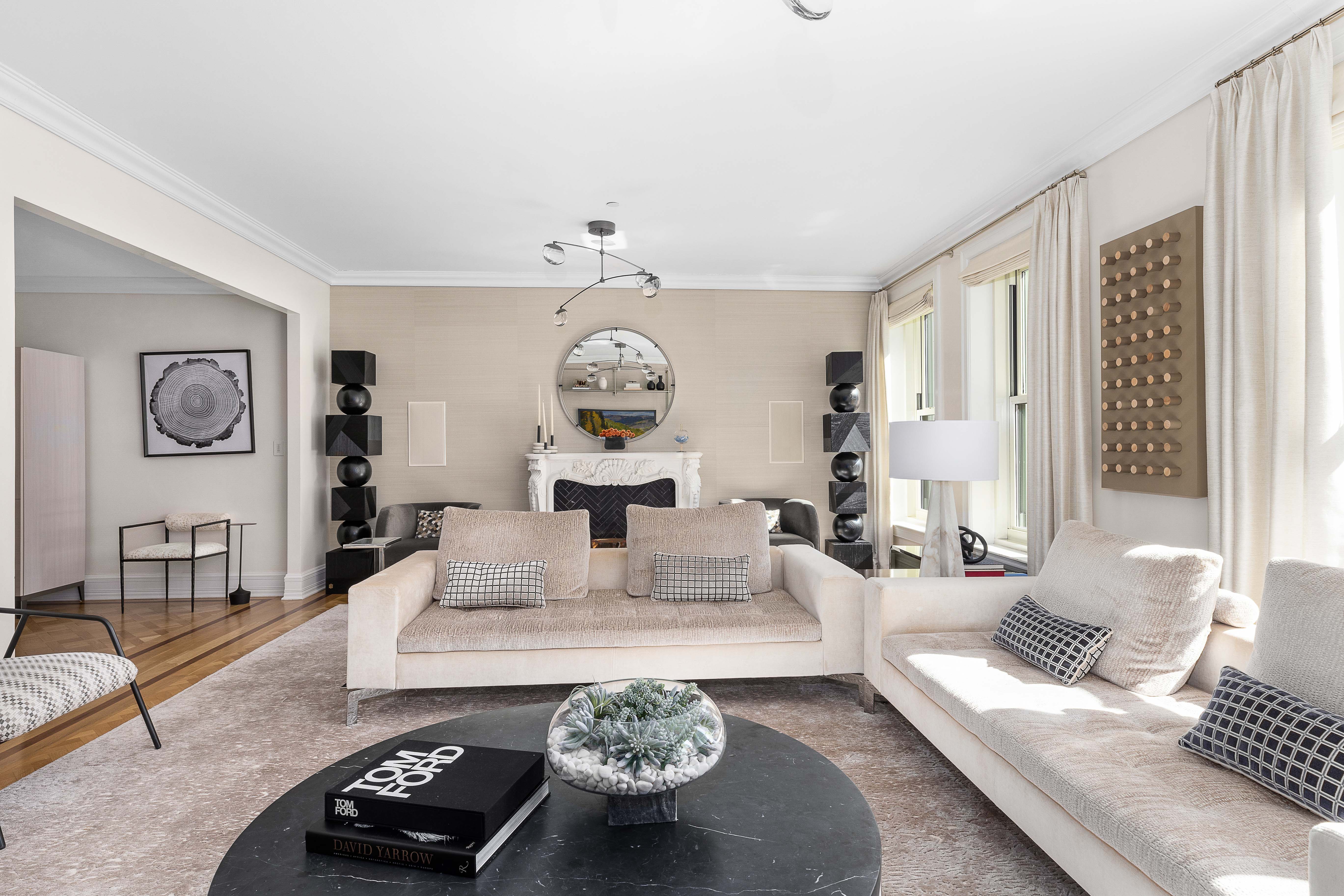 1 Central Park South, Unit 1513 Manhattan, NY 10019 - Photo 4 of 29 a living room with furniture and a table