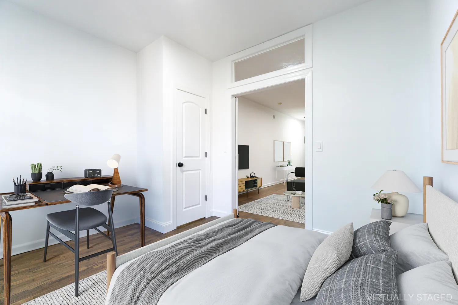 a bedroom with a bed and a table chair