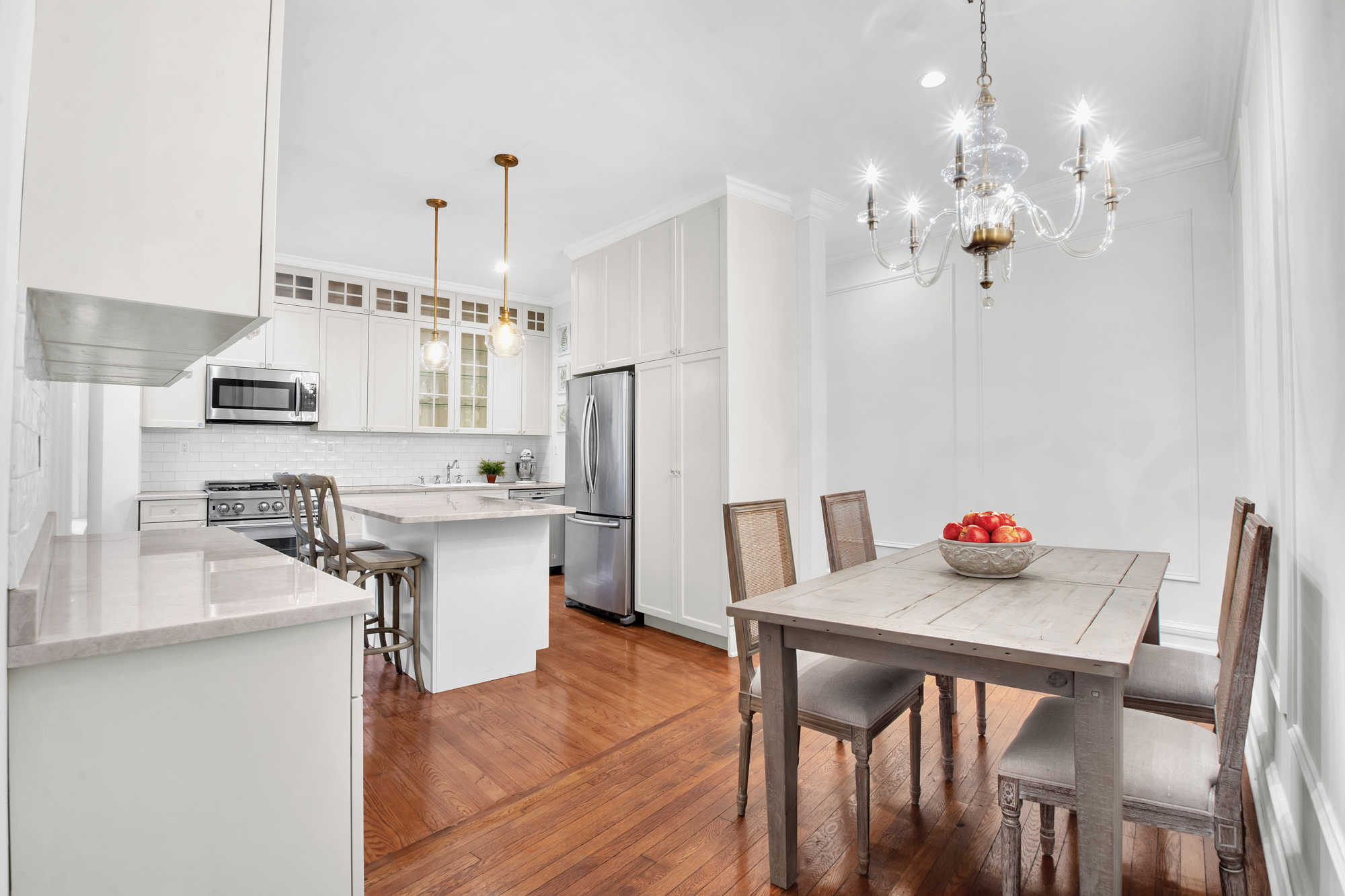 47 Fort Washington Avenue, Unit 55 Manhattan, NY 10032 - Photo 10 of 20 a kitchen with stainless steel appliances granite countertop a kitchen island hardwood floor and a sink