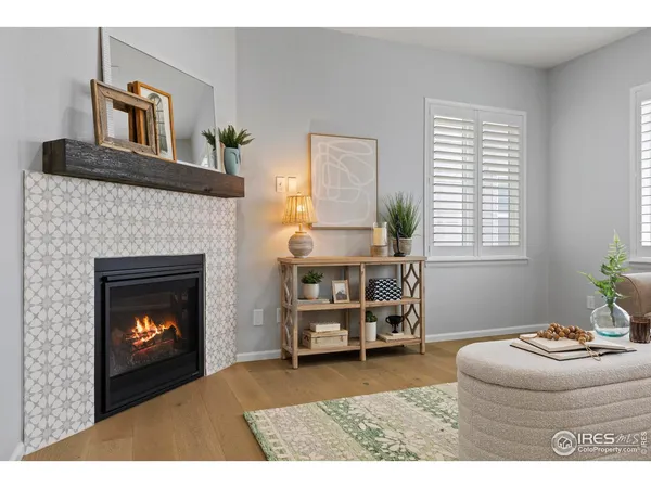 a kitchen with kitchen island granite countertop a sink refrigerator and microwave