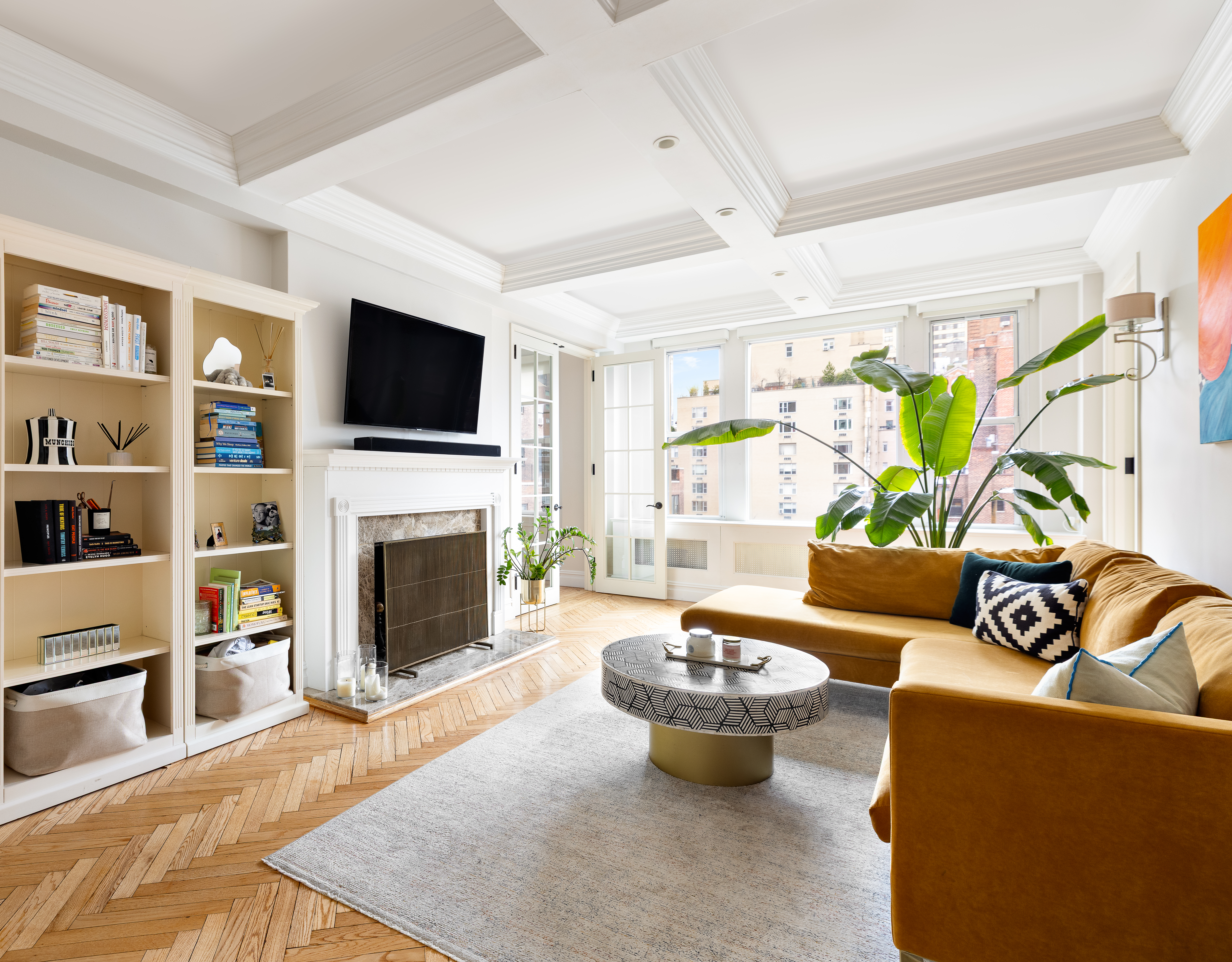 a living room with furniture fireplace and a flat screen tv