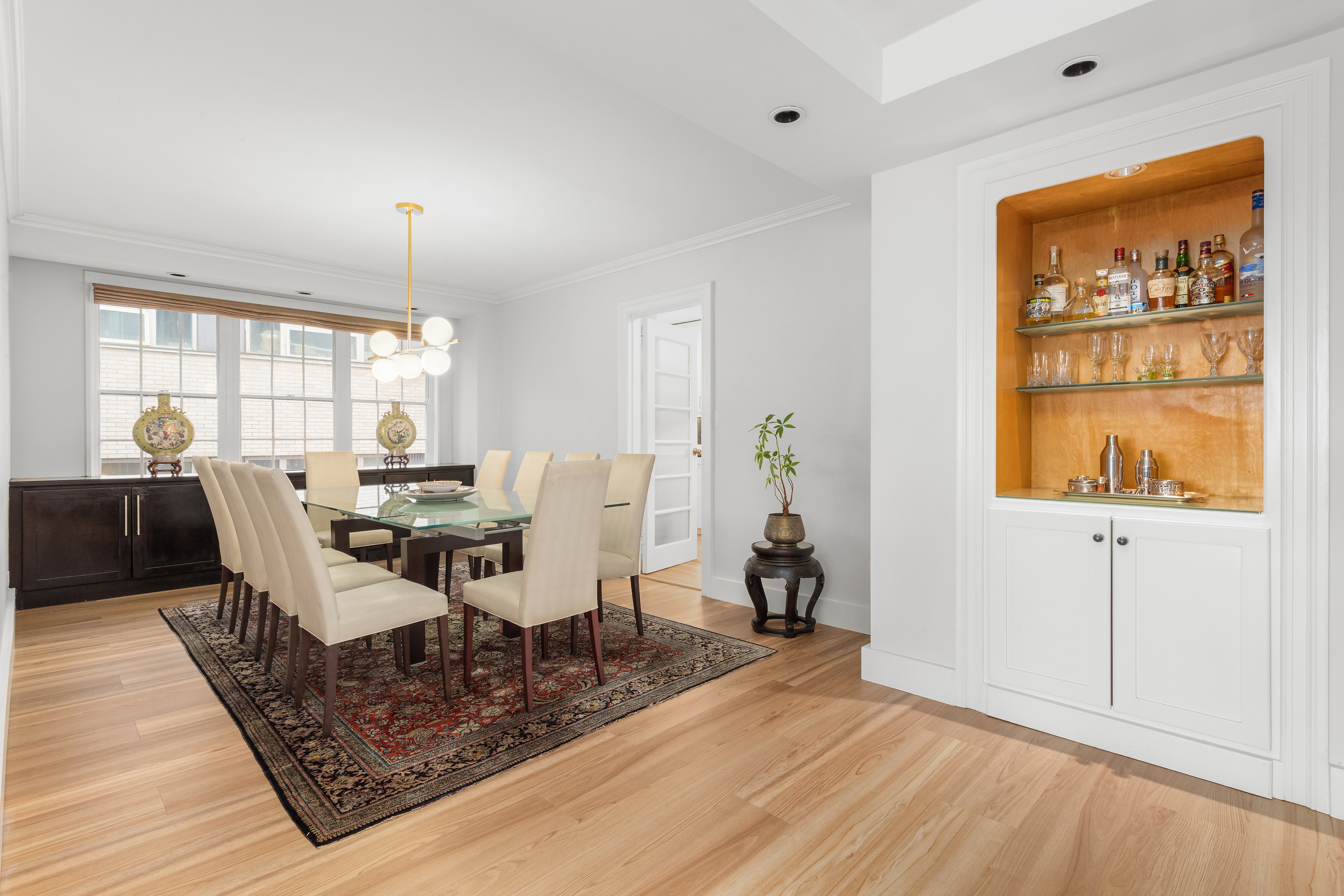 530 East 72nd Street, Unit 4F Manhattan, NY 10021 - Photo 5 of 23 a workspace with furniture window and wooden floor