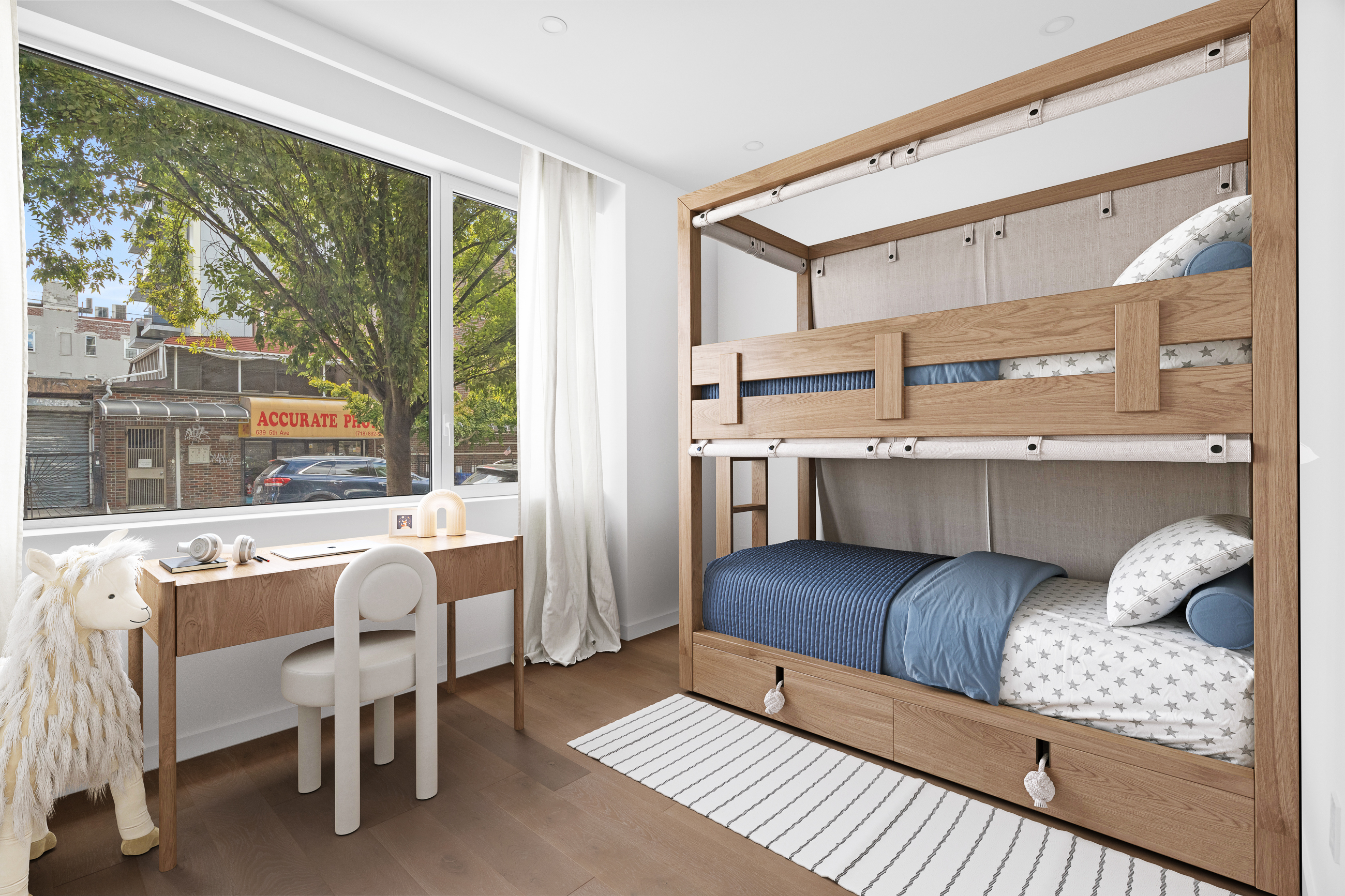 249 18th Street, Unit 1 Brooklyn, NY 11215 - Photo 6 of 12 a living room with furniture and a large window