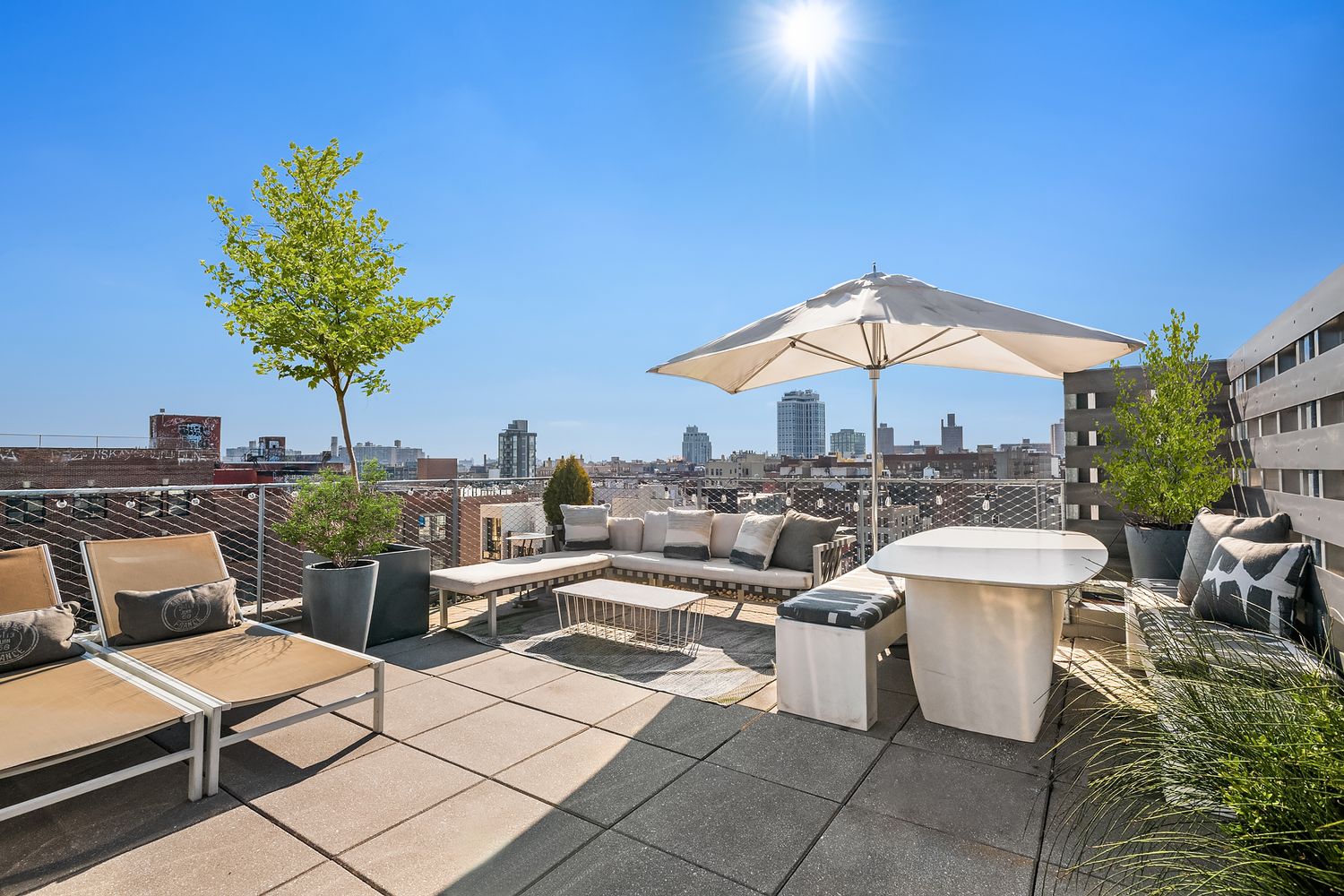 280 Metropolitan Avenue, Unit 5D Brooklyn, NY 11211 - Photo 17 of 22 a view of a patio with couches and potted plants