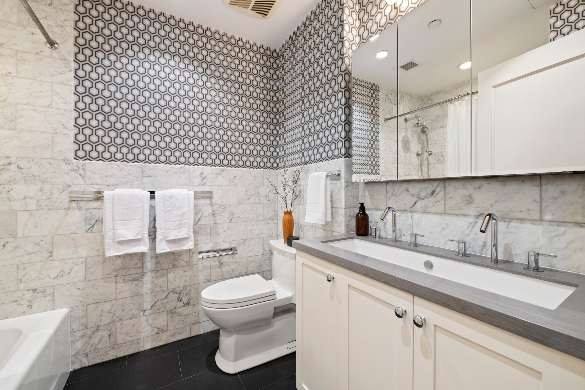 30 West 13th Street, Unit 4C Manhattan, NY 10011 - Photo 19 of 22 a bathroom with a sink a toilet and shower