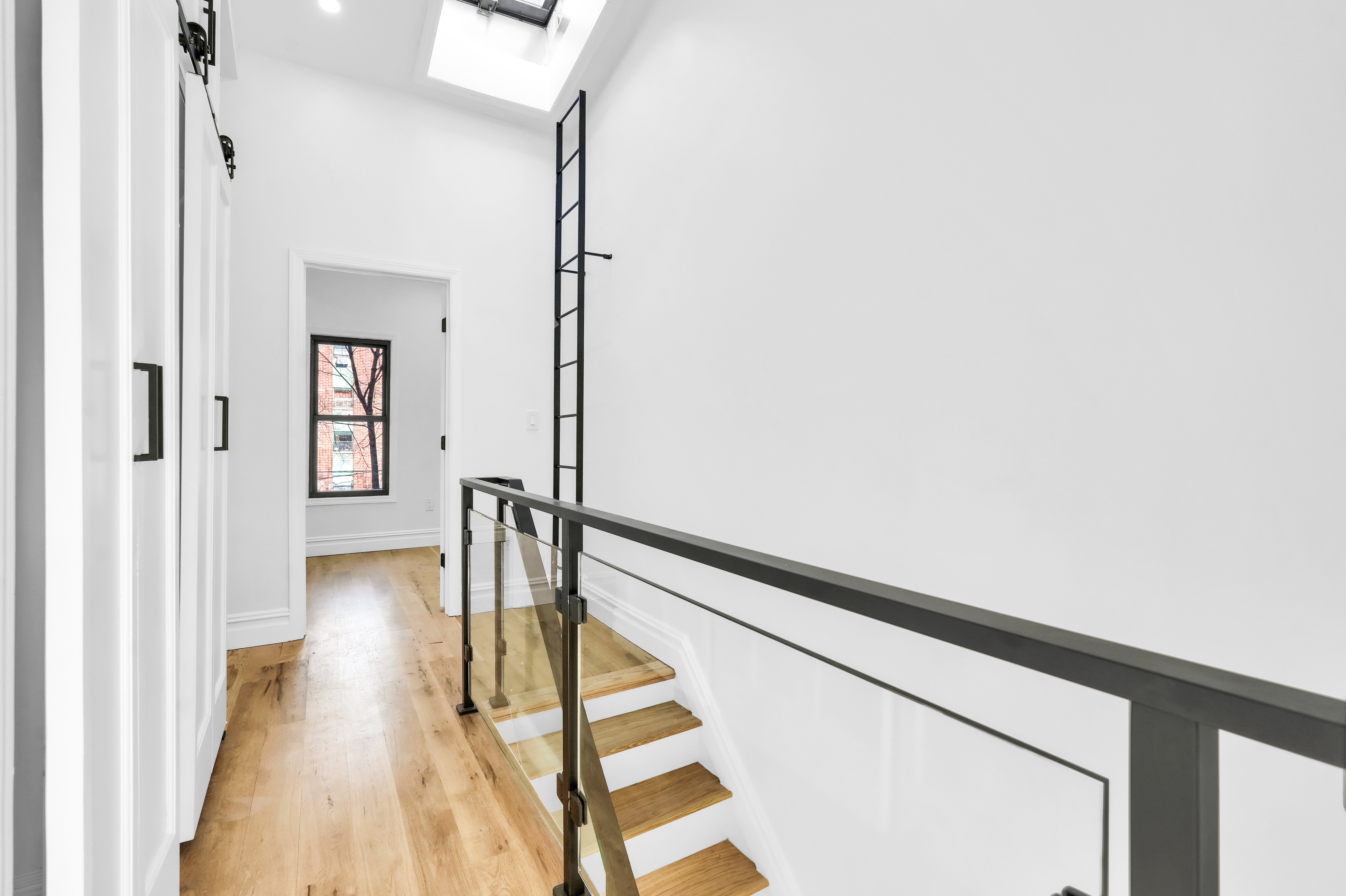 473 Monroe Street Brooklyn, NY 11221 - Photo 17 of 40 a view of entryway with wooden floor