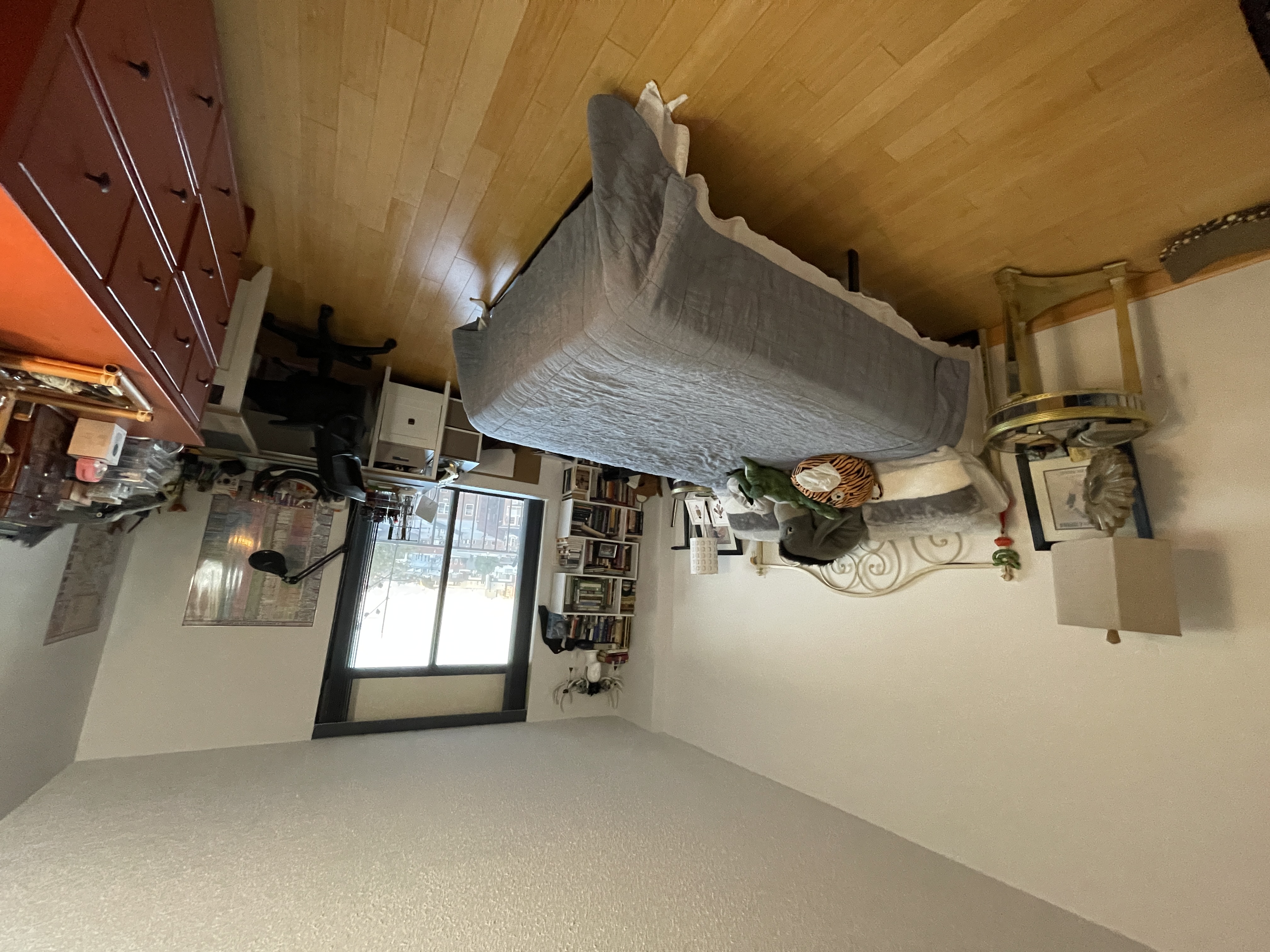 25-40 Shore Boulevard, Unit 5B Queens, NY 11102 - Photo 5 of 17 a bedroom with a bed and wooden floor