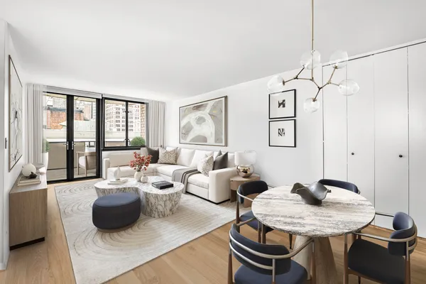 a living room with furniture and a window