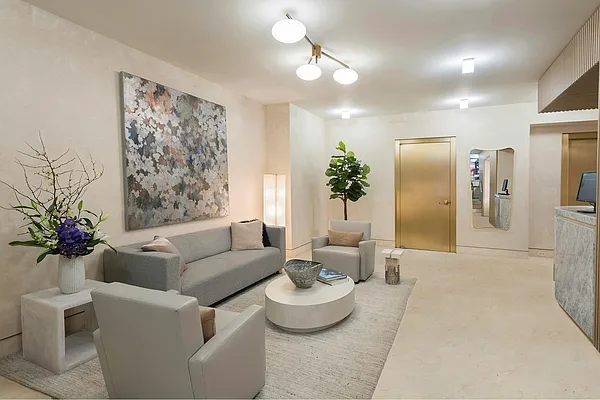 30 East 65th Street, Unit 6B Manhattan, NY 10065 - Photo 13 of 14 a living room with furniture and a chandelier