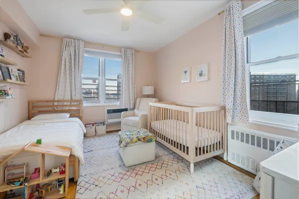 a bedroom with furniture and a window