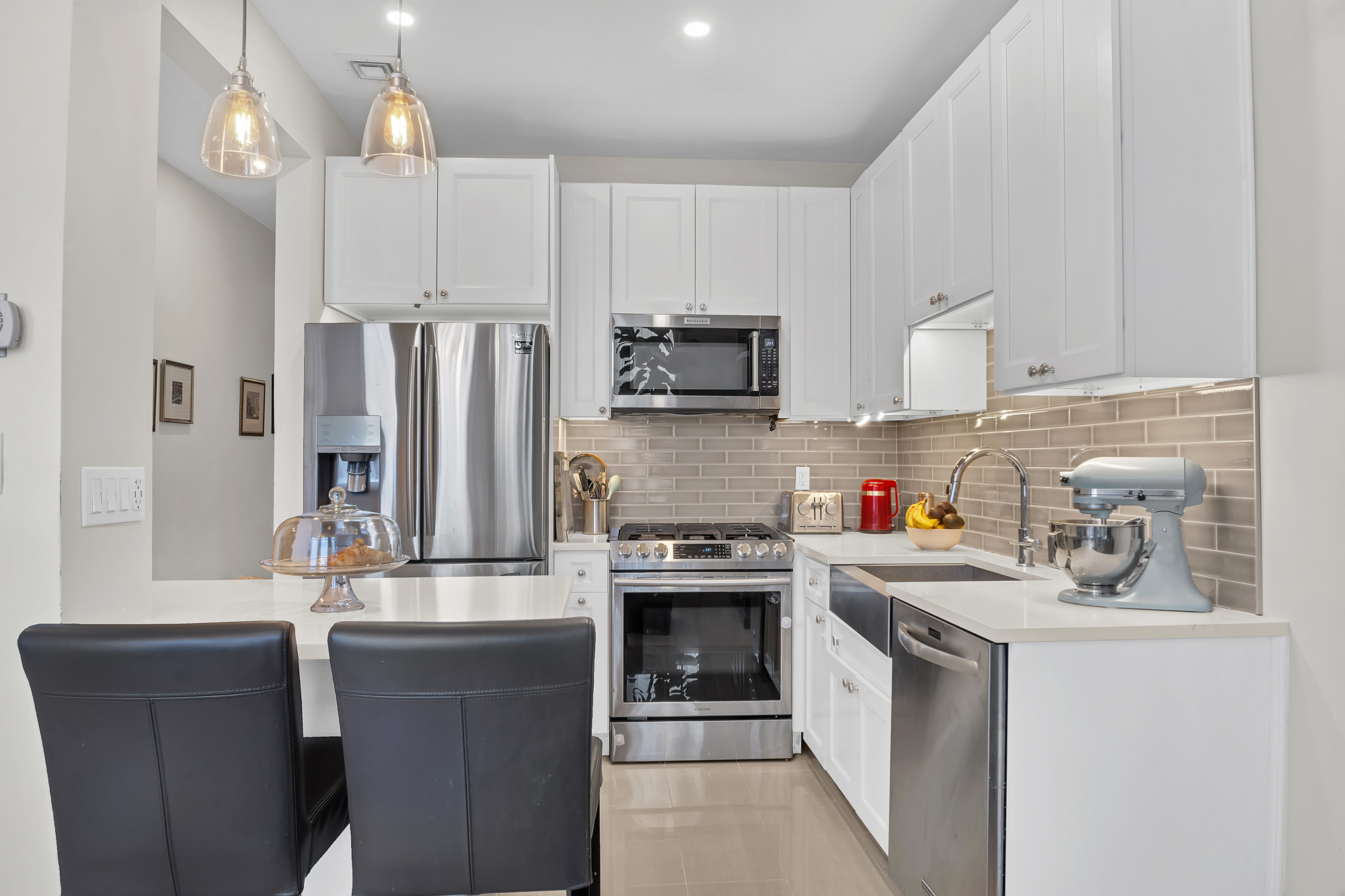 8 Mt Morris Park West, Unit C Manhattan, NY 10027 - Photo 5 of 12 a kitchen with stainless steel appliances a stove refrigerator sink and microwave