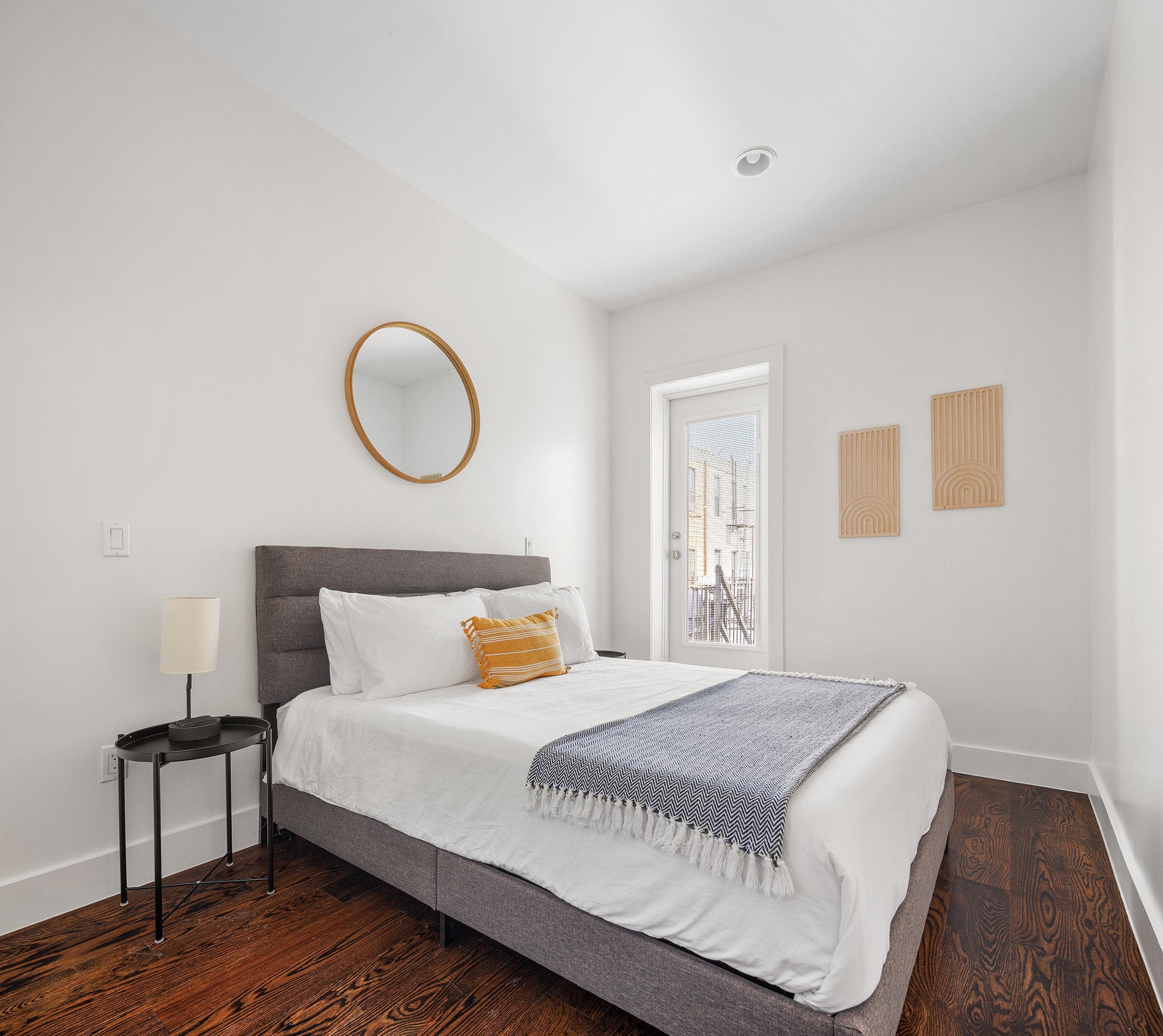 253 Wyckoff Avenue, Unit 2 Brooklyn, NY 11237 - Photo 5 of 8 a bedroom with a bed and wooden floor