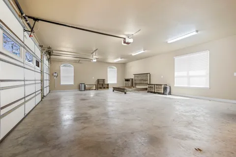a view of a kitchen with a sink and a window