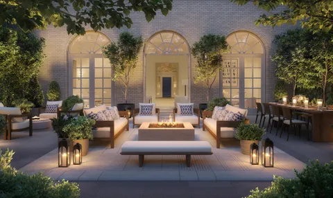 a view of a house with couches and a potted plant