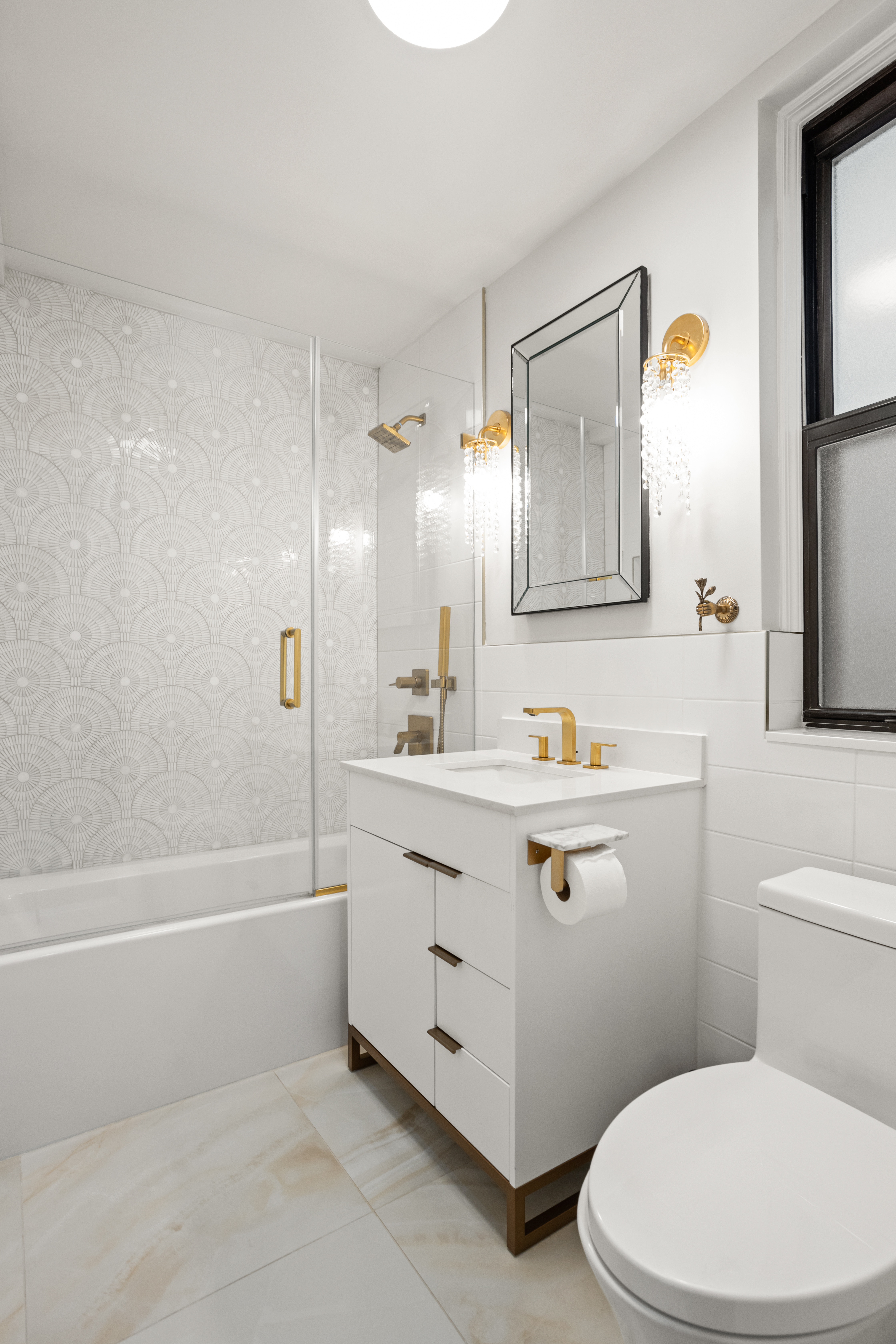 107 West 86th Street, Unit 3H Manhattan, NY 10024 - Photo 6 of 7 a bathroom with a sink a toilet and shower