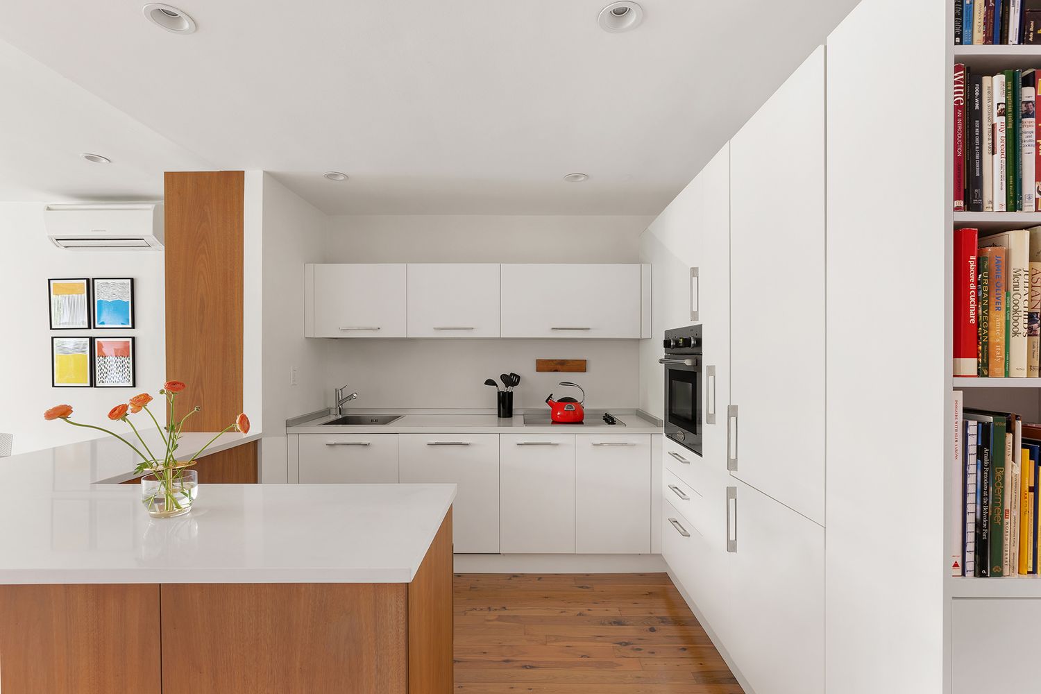 a kitchen with a sink a stove and cabinets