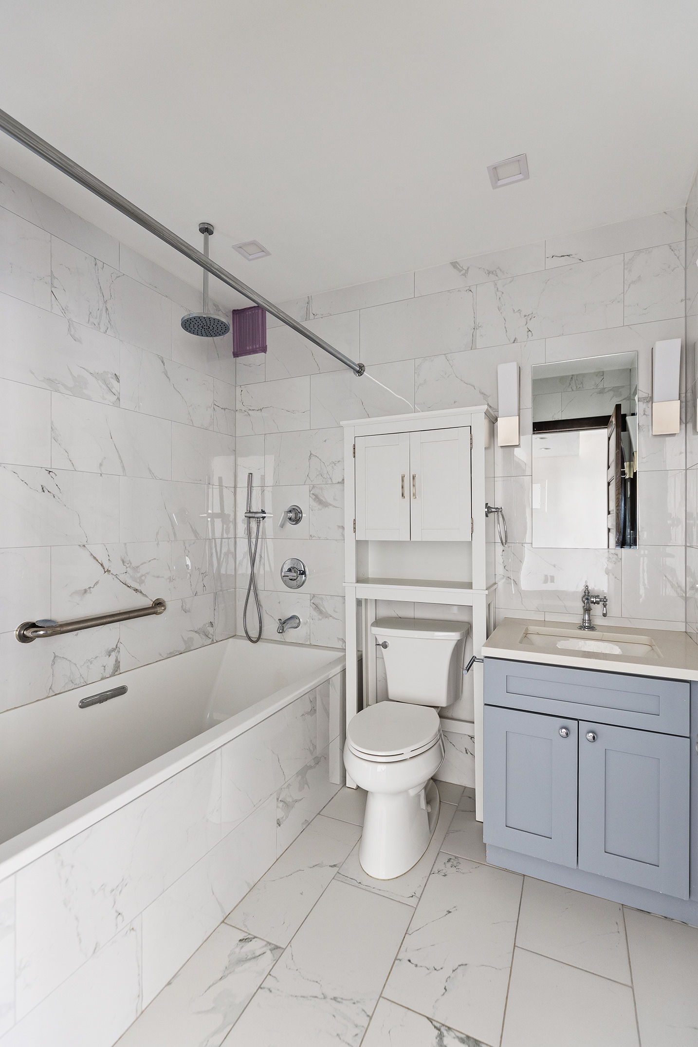 380 Rector Place, Unit 7LMN Manhattan, NY 10280 - Photo 7 of 14 a bathroom with a granite countertop toilet a sink and bathtub