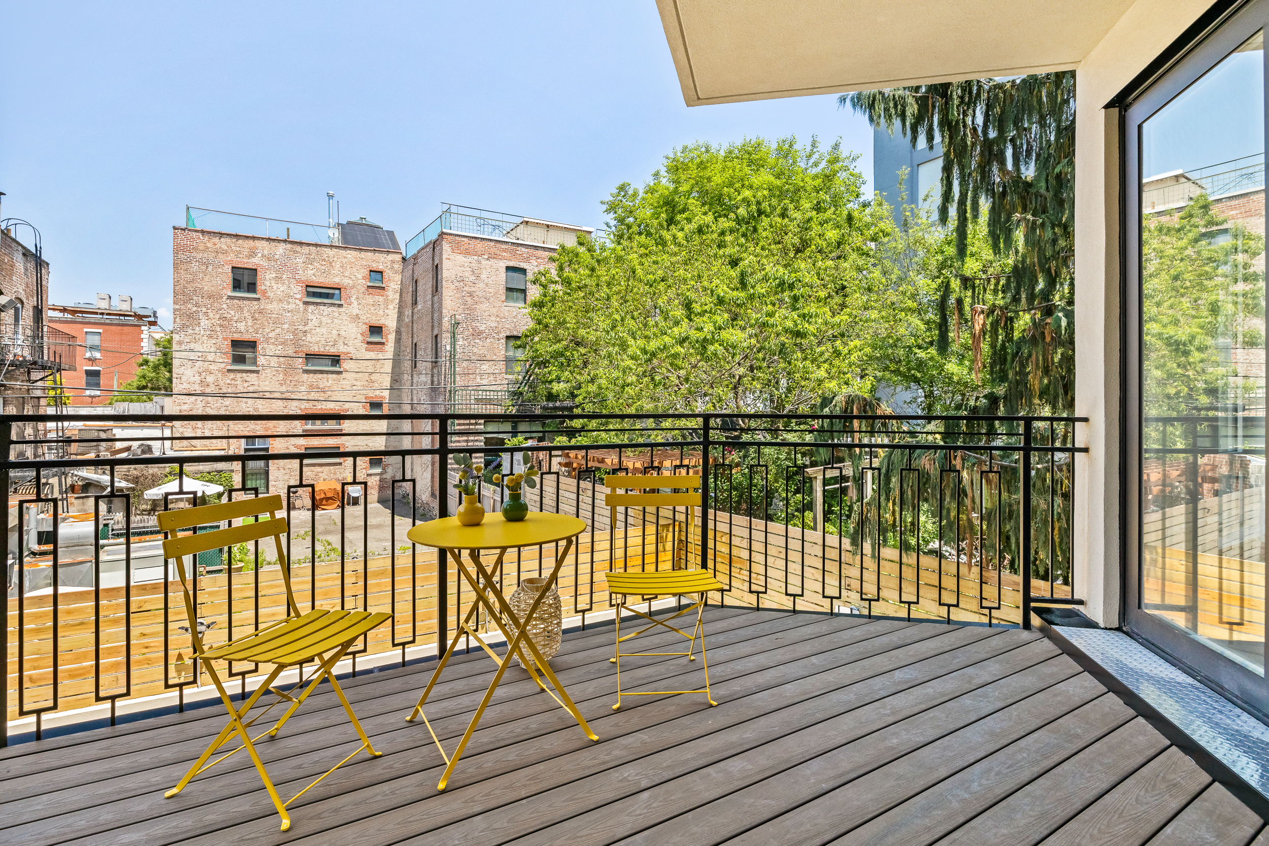 249 18th Street, Unit 3 Brooklyn, NY 11215 - Photo 8 of 14 a view of balcony with wooden floor and fence