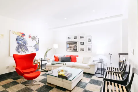 a living room with furniture and rug