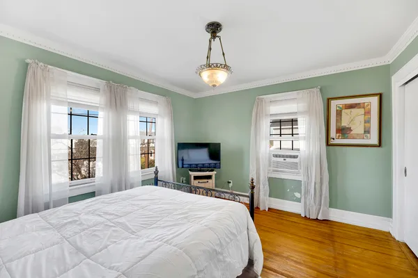 a view of a room with furniture and window