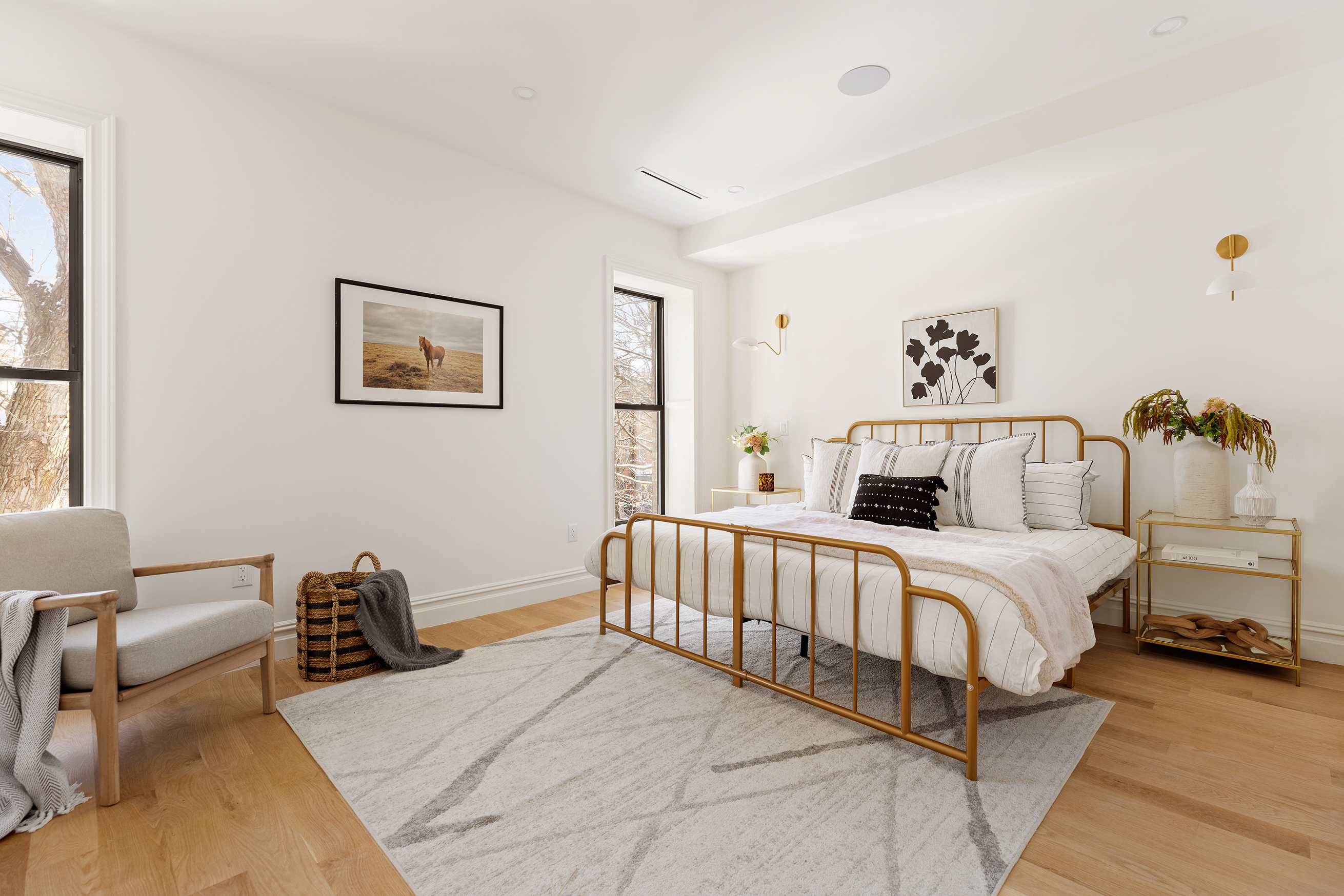 15 Verona Place Brooklyn, NY 11216 - Photo 7 of 14 a spacious bedroom with a bed and a couch