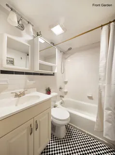 a bathroom with a sink a toilet and a bathtub
