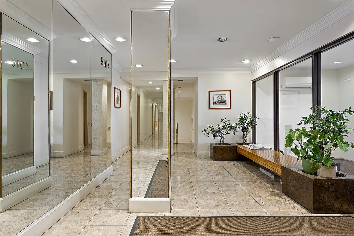 510 West 110th Street, Unit 2E Manhattan, NY 10025 - Photo 9 of 13 a view of a hallway with wooden floor and a potted plant
