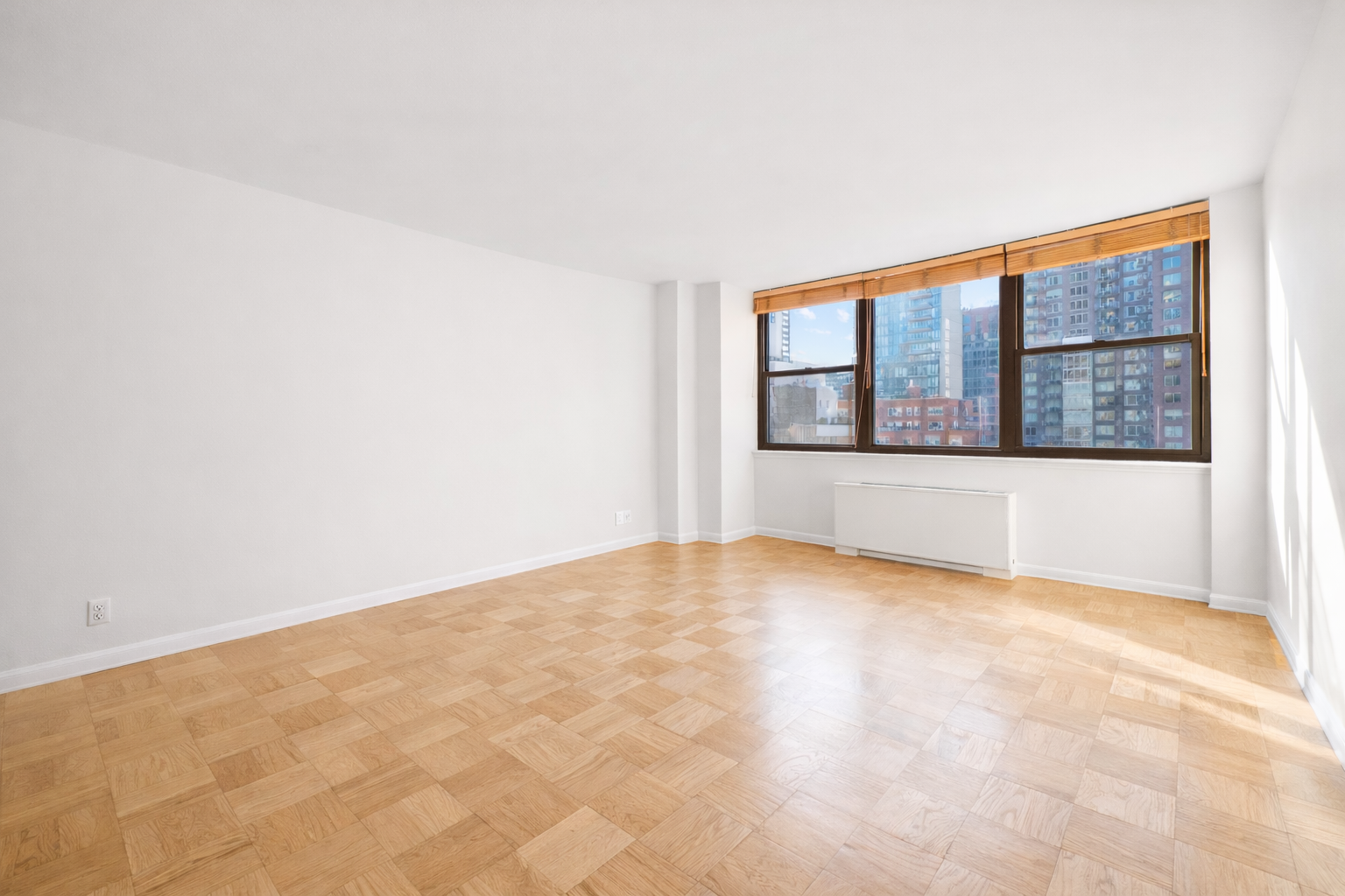 225 East 36th Street, Unit 10N Manhattan, NY 10016 - Photo 11 of 13 an empty room with windows