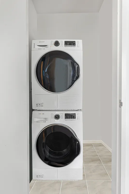 300 East 23rd Street, Unit 5B Manhattan, NY 10010 - Photo 9 of 10 a utility room with dryer and washer