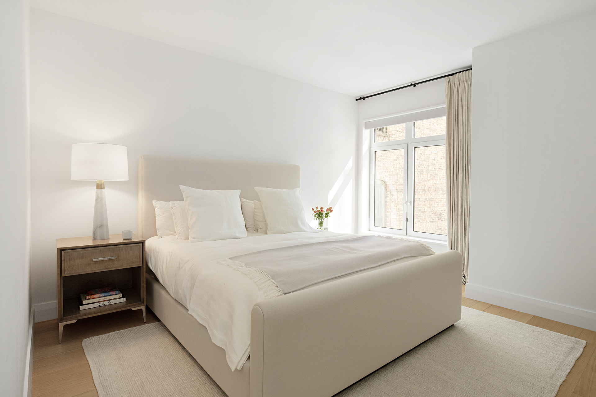 200 East 83rd Street, Unit 4A Manhattan, NY 10028 - Photo 6 of 26 a bedroom with a bed and a window