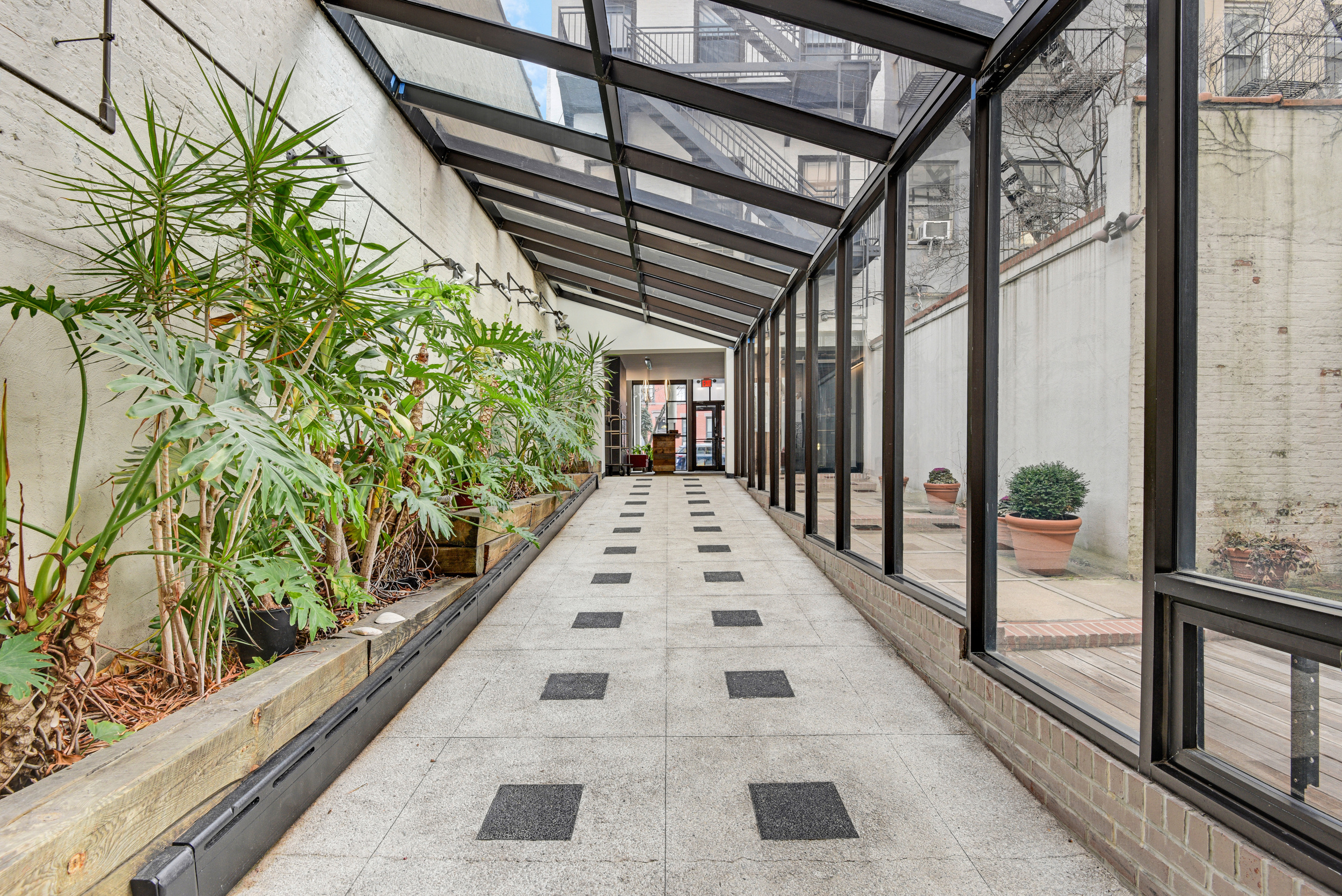 492 Henry Street, Unit 2A Brooklyn, NY 11231 - Photo 9 of 13 a view of a balcony with a potted plant