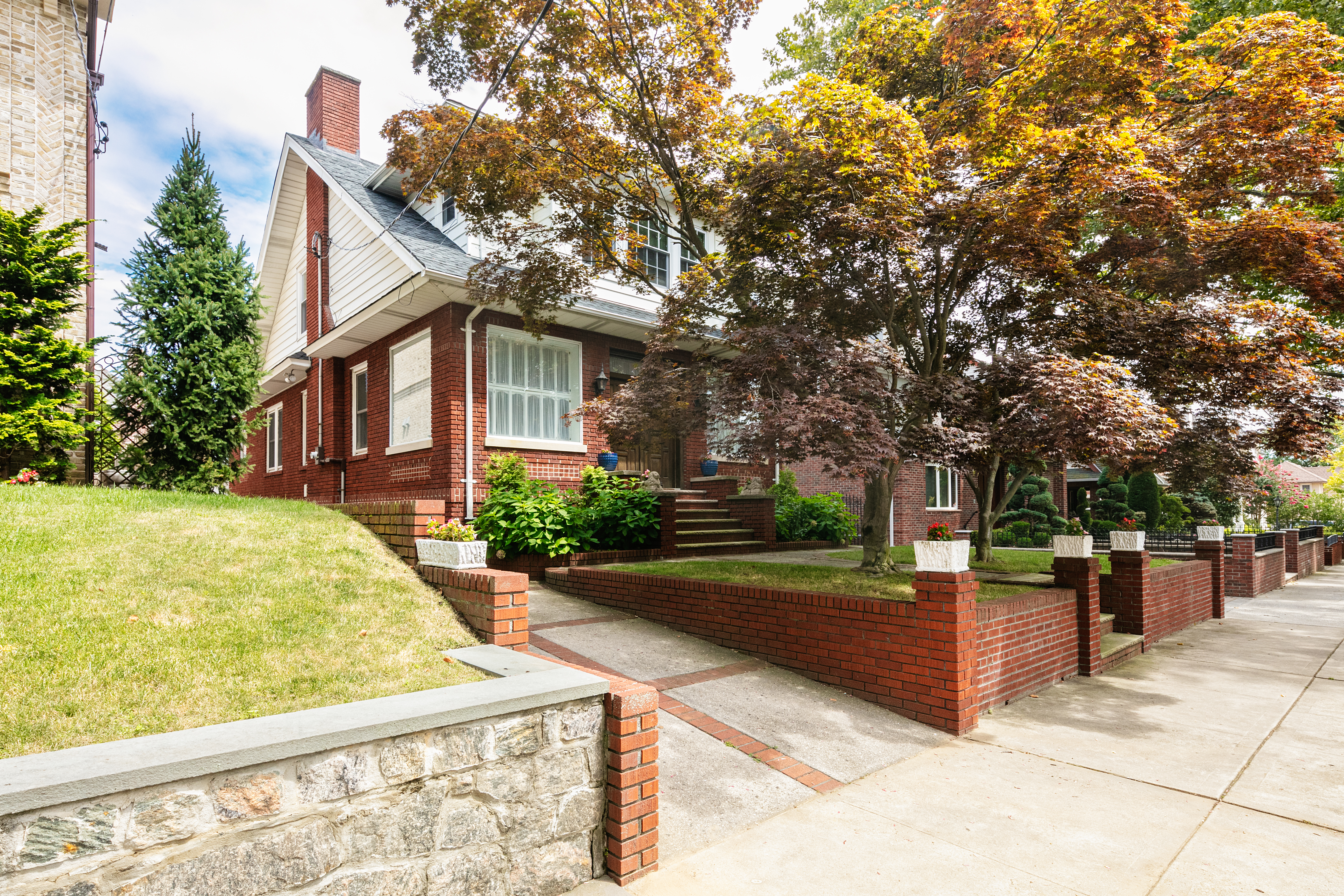 91 81st Street Brooklyn, NY 11209 - Photo 2 of 19 a front view of a house with tree s