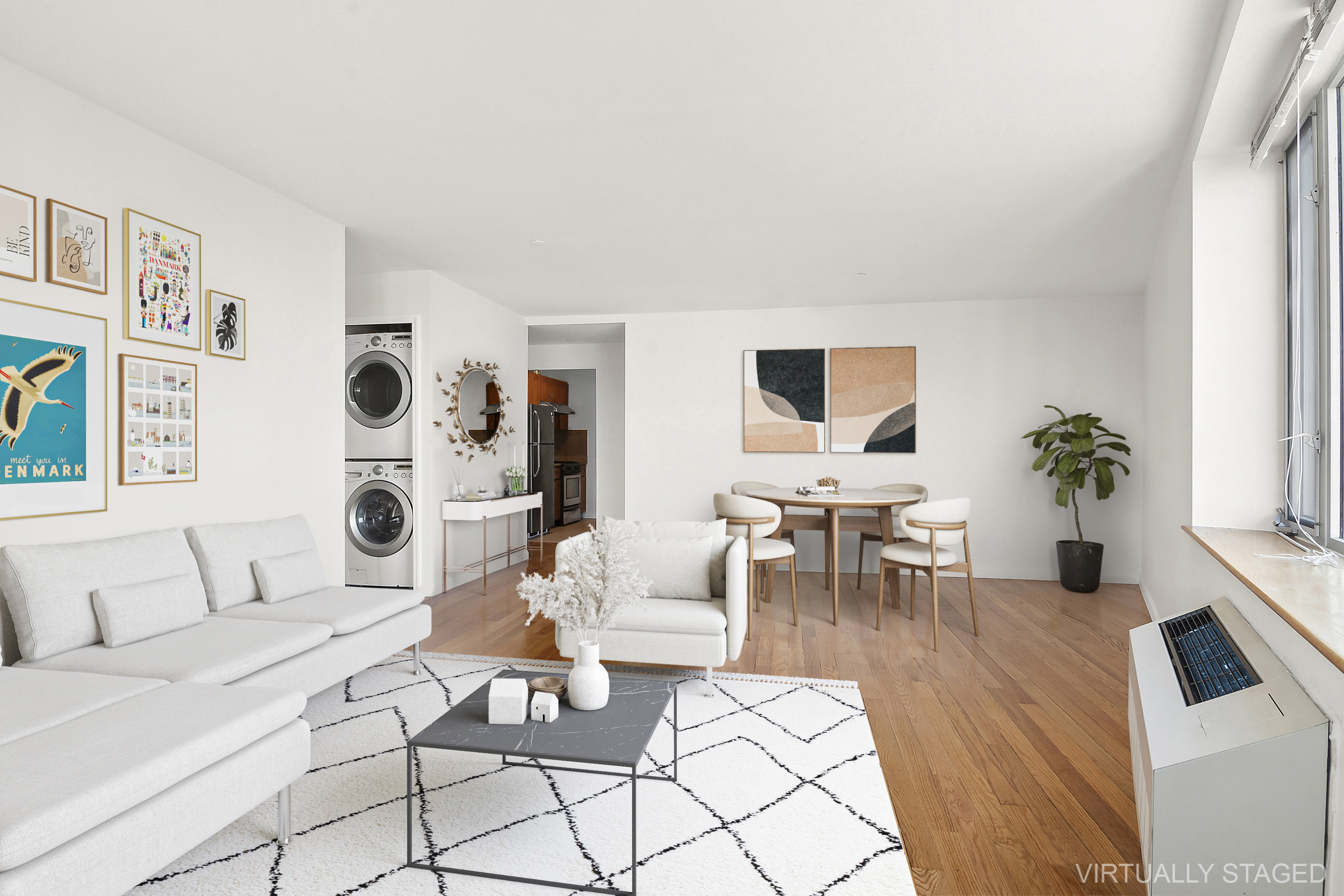 a living room with furniture and a potted plant