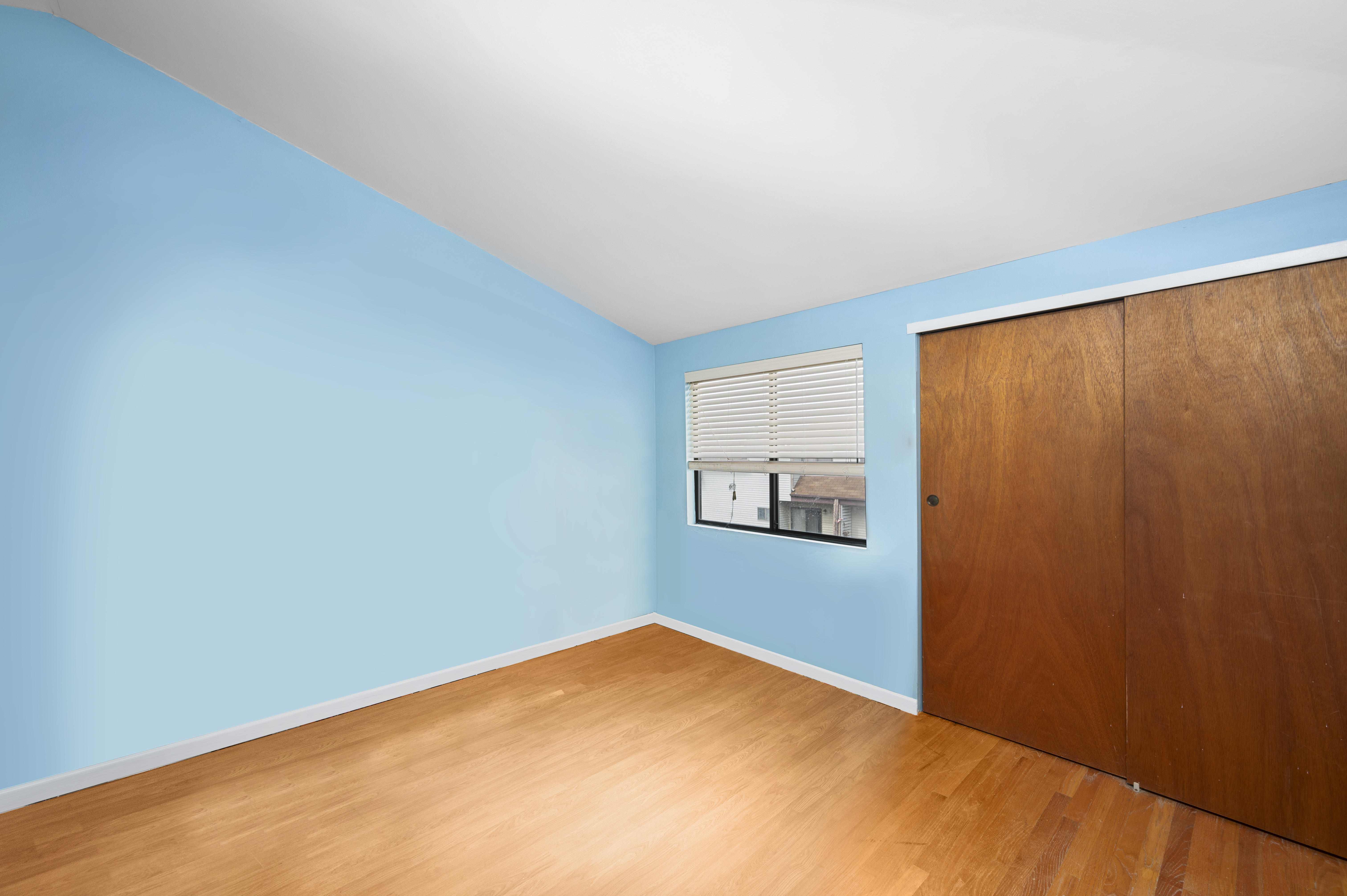 20 Eric Lane Staten Island, NY 10308 - Photo 11 of 20 a view of a room with a wooden floor and a window