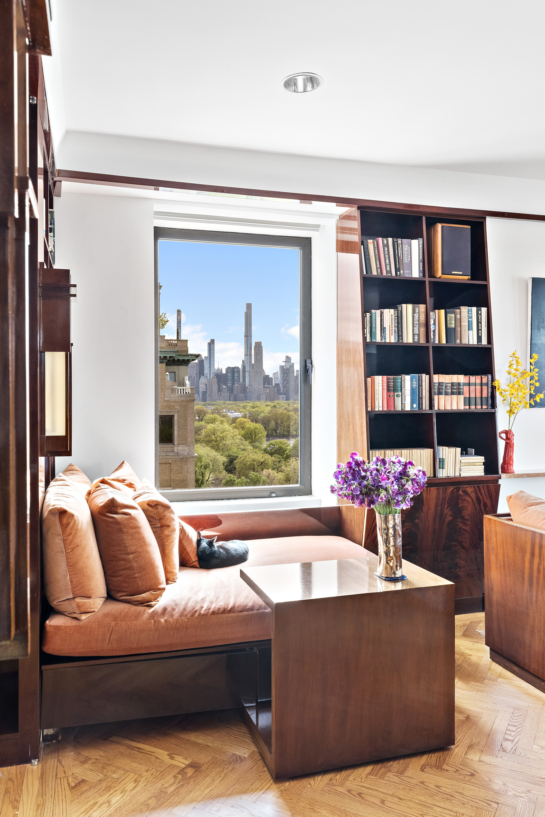 1115 5th Avenue, Unit 15A Manhattan, NY 10128 - Photo 8 of 27 a living room with furniture and a large window