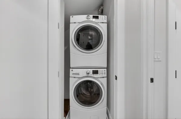 a view of a bedroom with furniture wooden floor and window