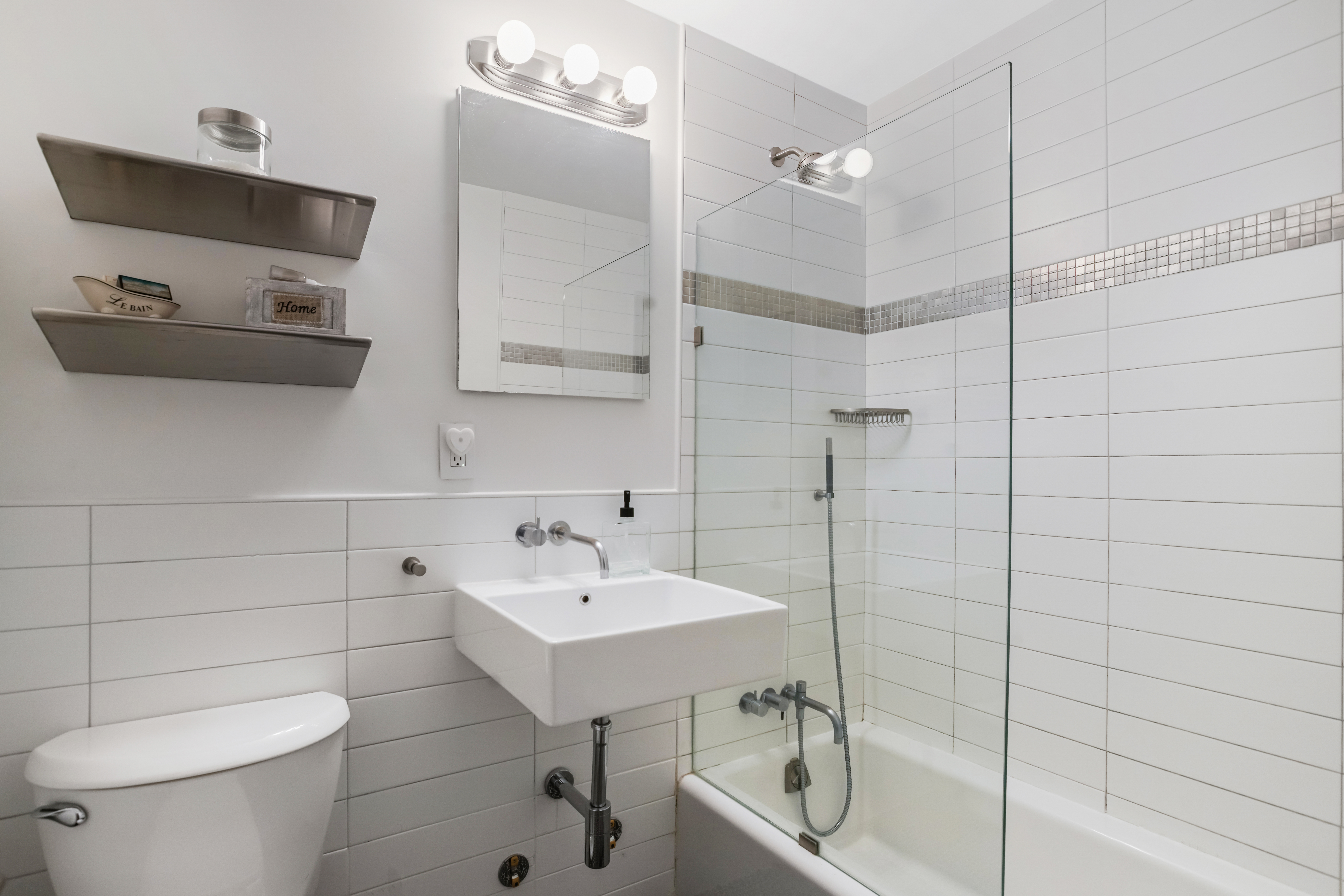 310 East 23rd Street, Unit 3B Manhattan, NY 10010 - Photo 8 of 11 a bathroom with a toilet sink and shower