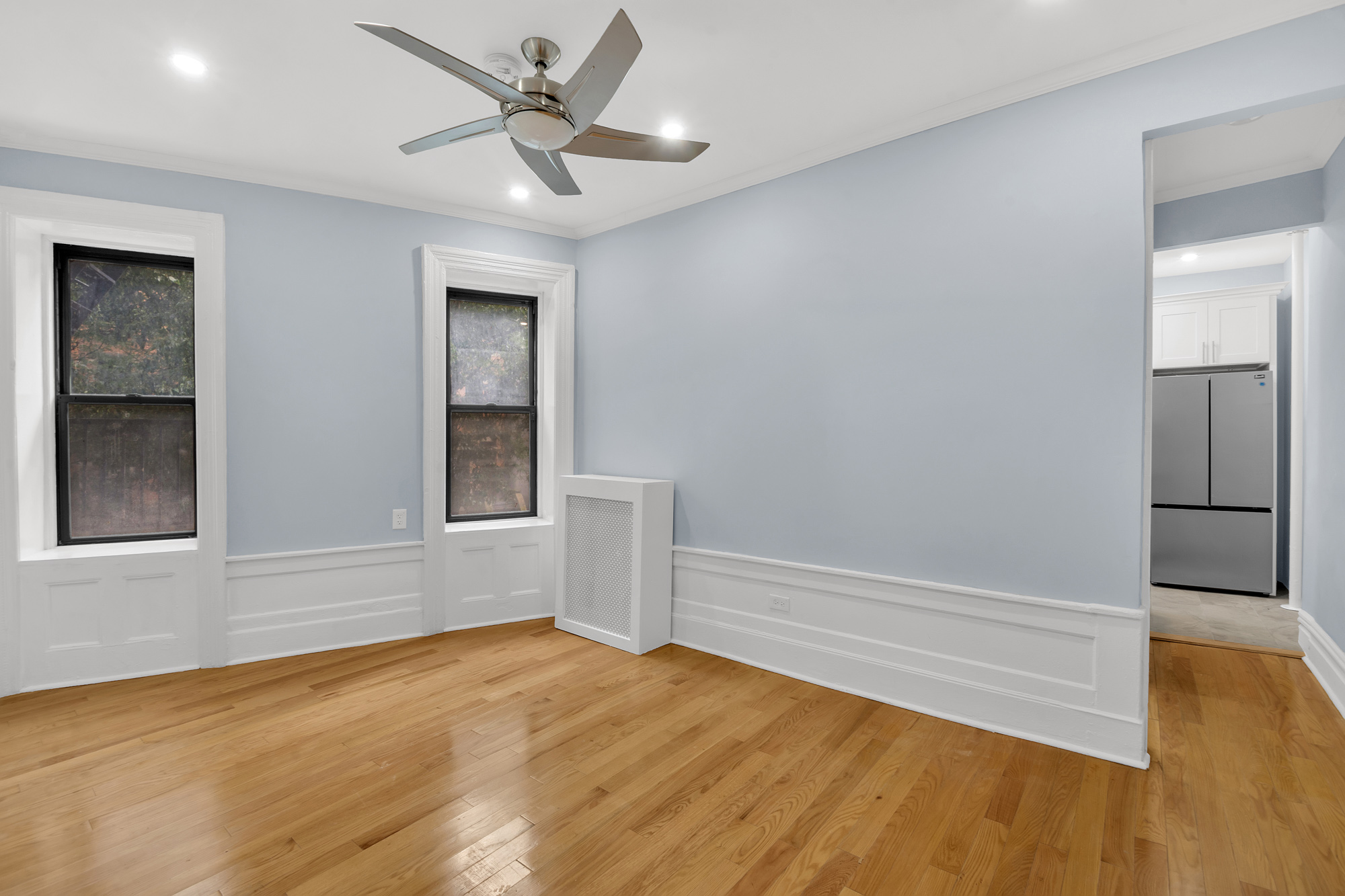 100 Hamilton Place, Unit 2F Manhattan, NY 10031 - Photo 10 of 21 wooden floor in an empty room with a window