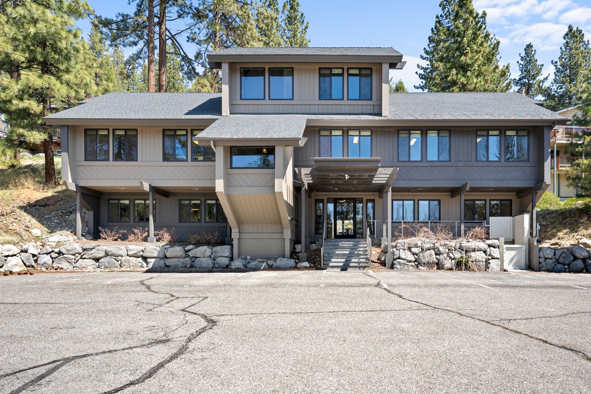 625 Highway 50 Zephyr Cove, NV 89448 - Photo 2 of 38 a view of a white house with large windows
