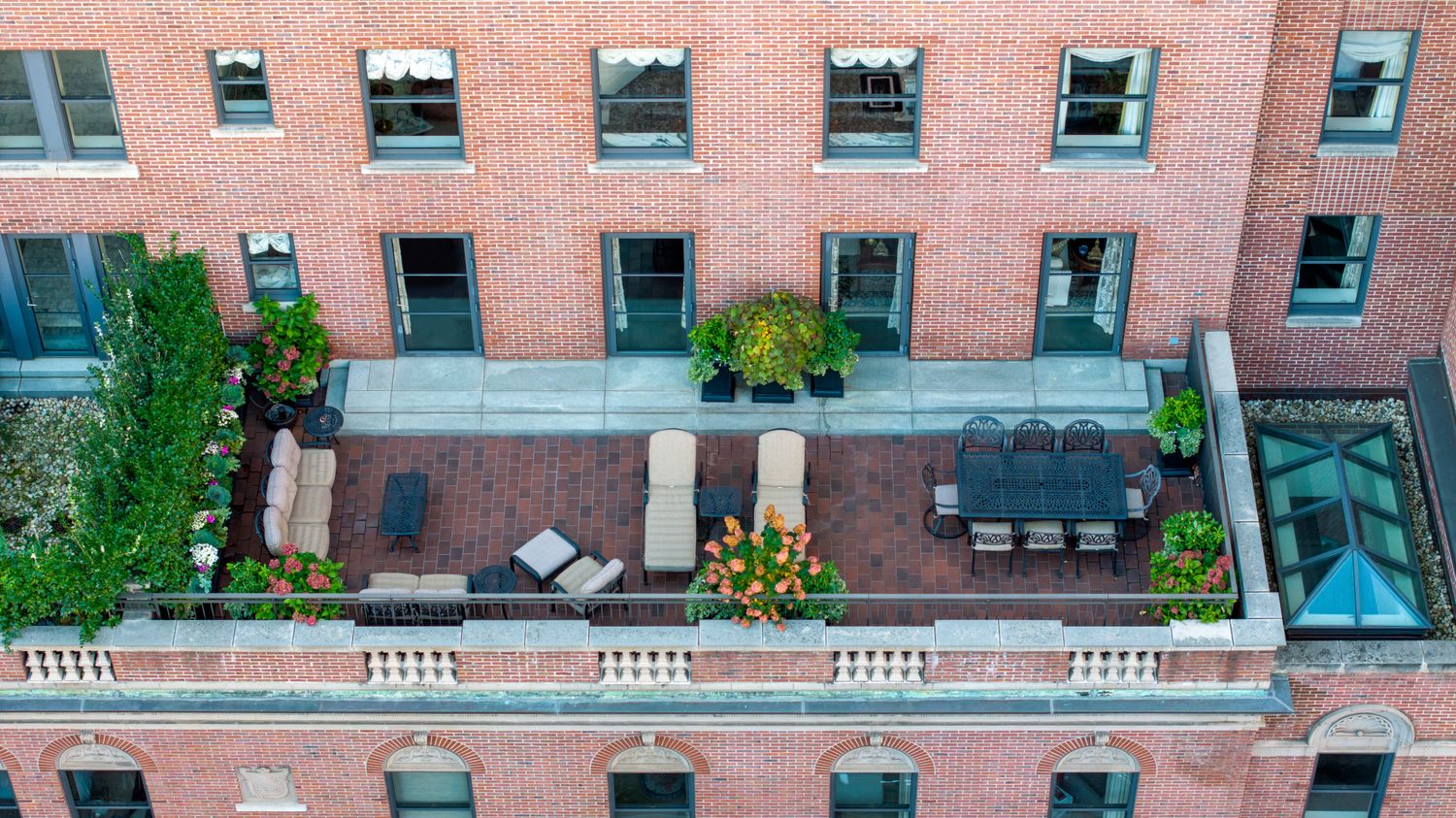 a front view of building with yard and seating area