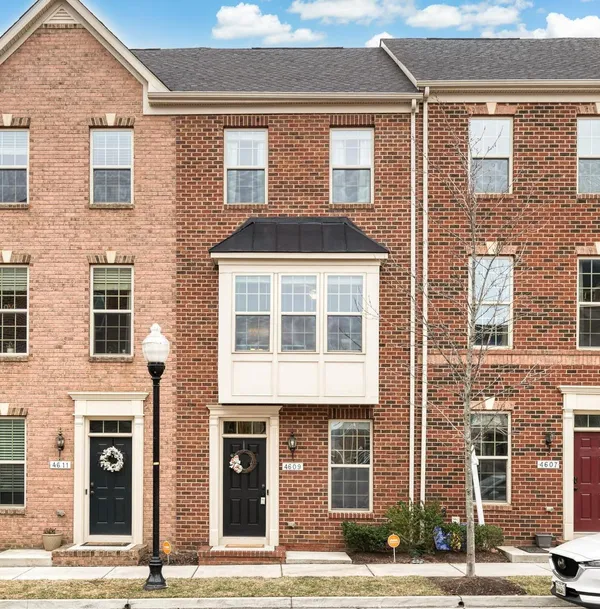 a front view of a brick building with many windows