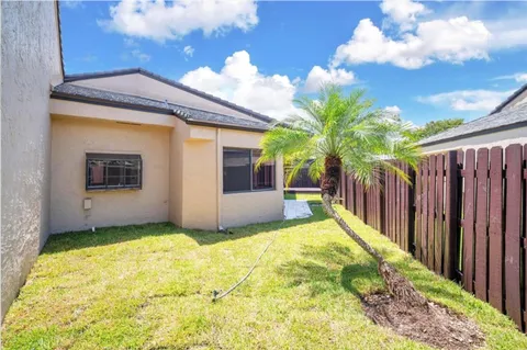 a view of a backyard of the house