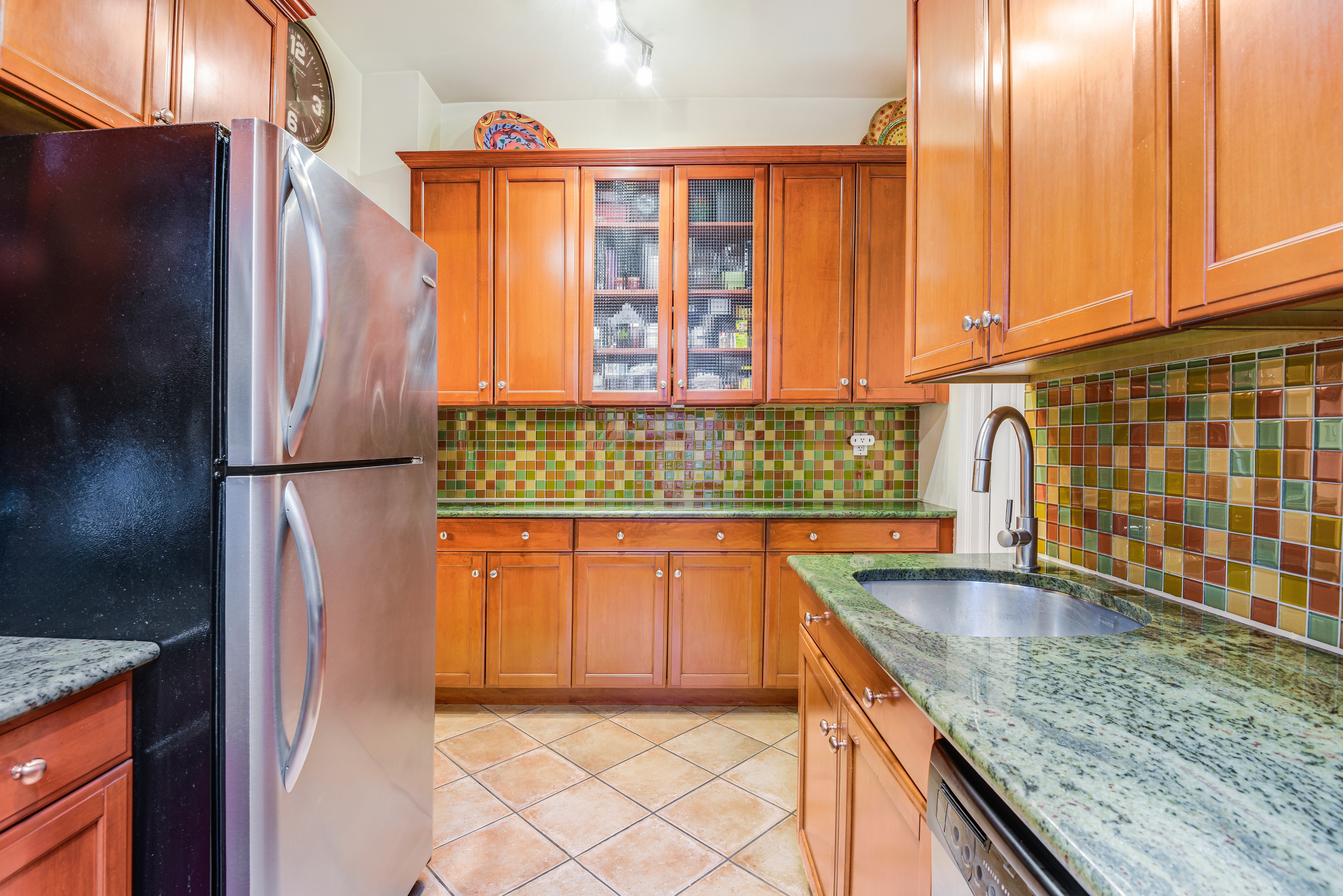 215 West 98th Street, Unit 8F Manhattan, NY 10025 - Photo 5 of 16 a kitchen with stainless steel appliances granite countertop a refrigerator and a sink