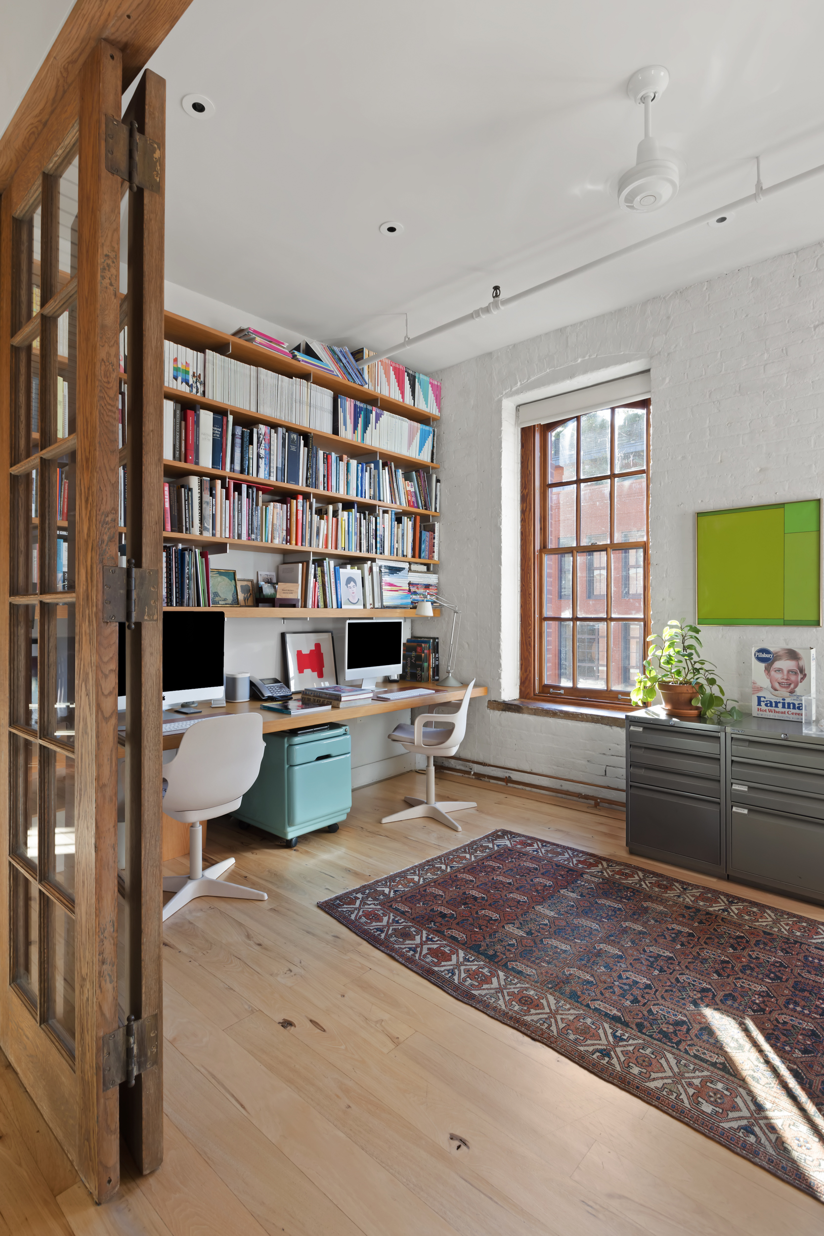 463 Greenwich Street Manhattan, NY 10013 - Photo 12 of 24 a living room with furniture and a rug