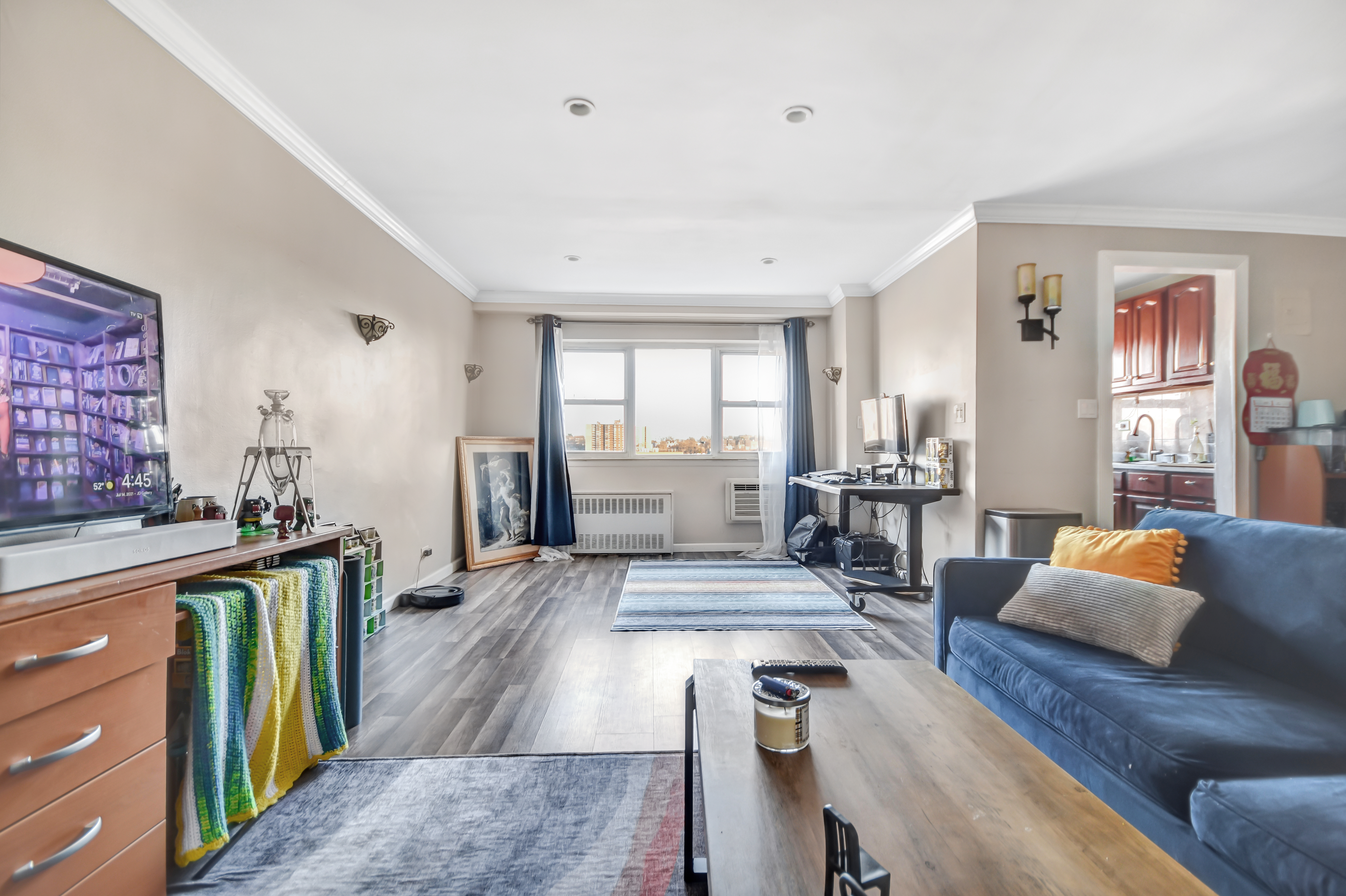 3240 Riverdale Avenue, Unit 4K Bronx, NY 10463 - Photo 1 of 2 a living room with furniture and a large window