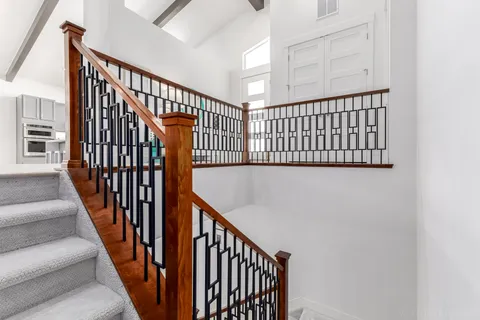a spacious bedroom with a bed and a shower